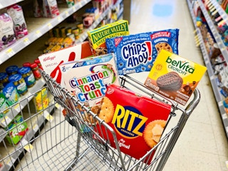 shopping cart with snacks and cereal boxes