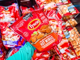 hand holding a bag of tyson anytizers wings at walmart