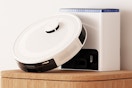 a robot vacuum against the base