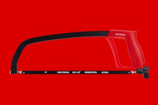 a red hand saw on a red background