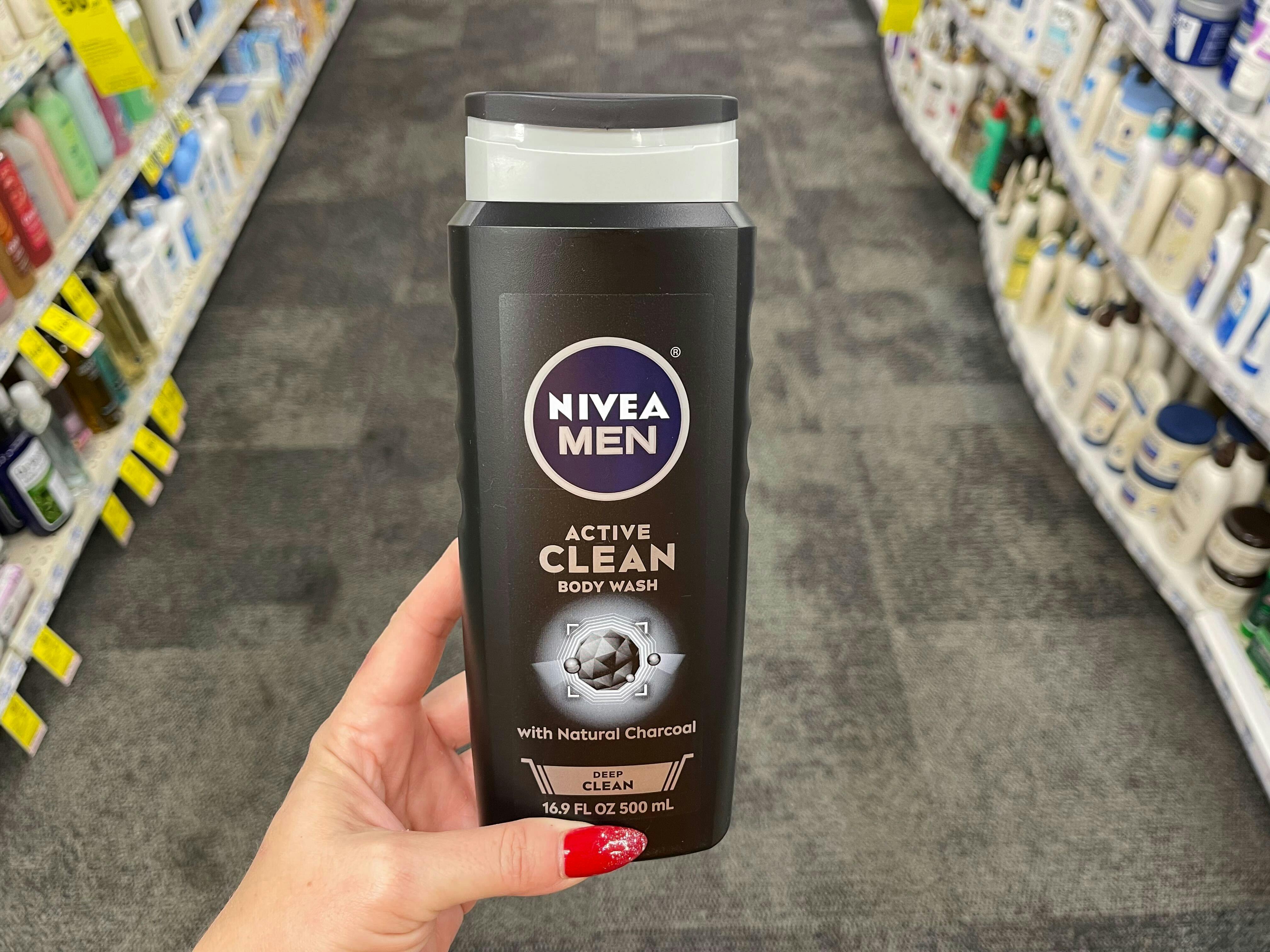 hand holding nivea men active clean body wash in cvs