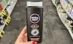 hand holding nivea men active clean body wash in cvs