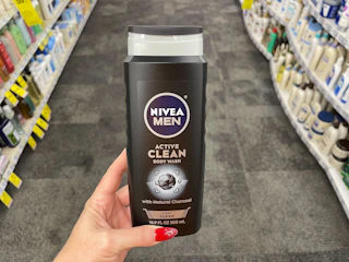 hand holding nivea men active clean body wash in cvs