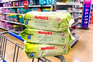 3 packs of huggies baby wipes on a cart