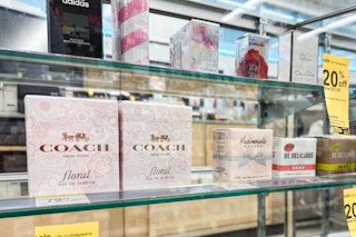 coach perfume on a glass shelf
