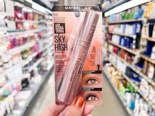 Hand holding a pack of Maybelline Sky High mascara