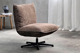 Lifestyle image of a modern chenille swivel chair in home setting