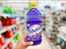 hand holding bottle of fabuloso