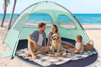 a family in a beach tent