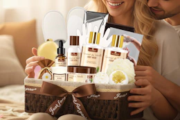 a woman holding a gift basket