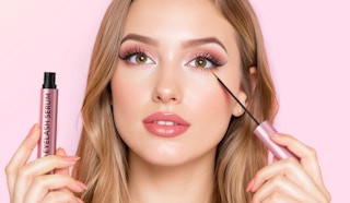 a person putting on eyelash serum 