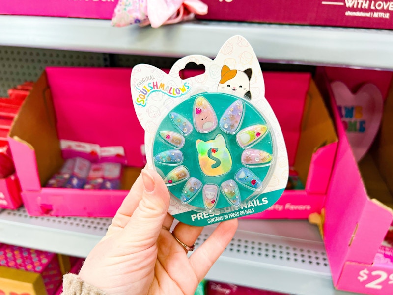 hand holding squishmallows press on nails at walmart