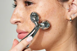 woman using a face roller