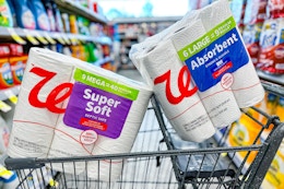 paper towels and toilet paper in a cart