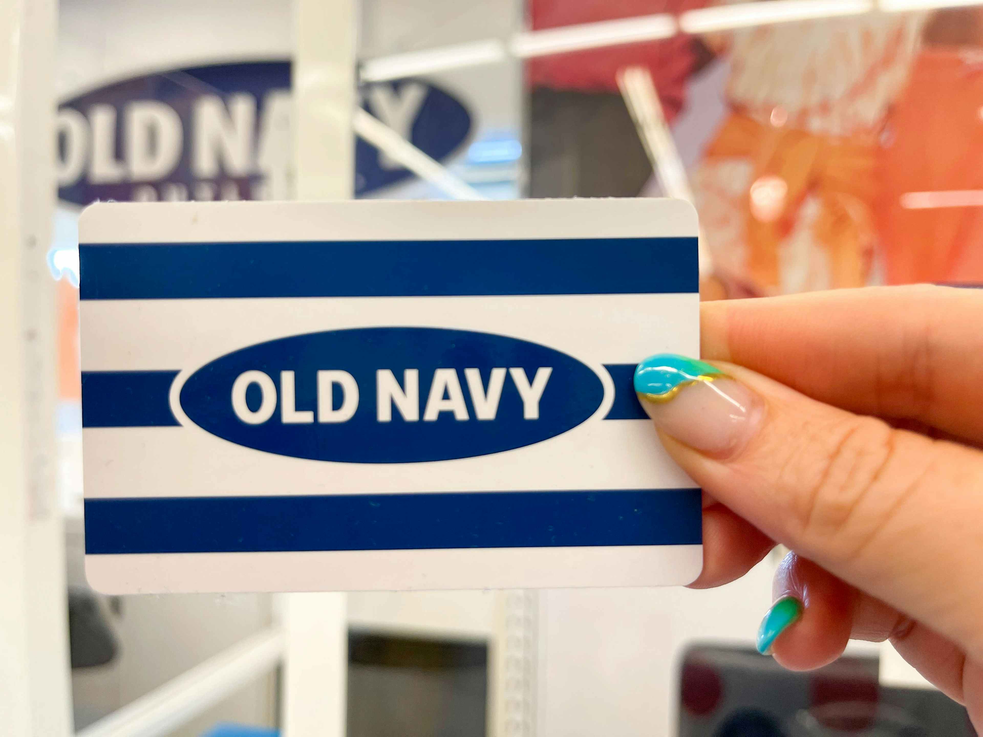 hand holding old navy gift card