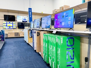 Best buy aisle showing televisions on sale
