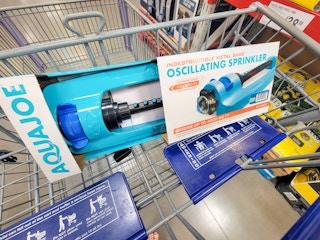 a teal sprinkler in the cart