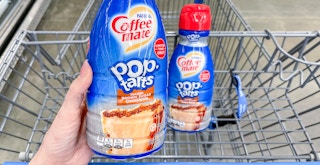 hand holding coffee mate new pop tarts creamer near cart