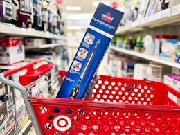 Bissell featherweight stick vacuum in front of a Target cart