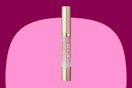 a pink and gold lip gloss stick