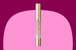 a pink and gold lip gloss stick