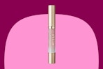 a pink and gold lip gloss stick
