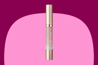 a pink and gold lip gloss stick