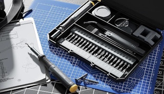a screwdriver set on a work station 