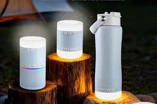 camping lantern water bottle on a piece of wood