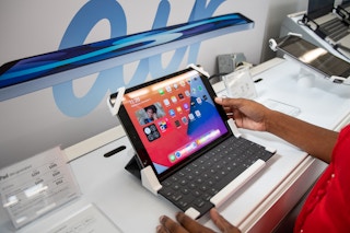 Someone looking at an Apple iPad at Walmart