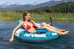 a woman floating in an intex river pro lounger