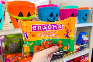 hand holding brachs candy corn