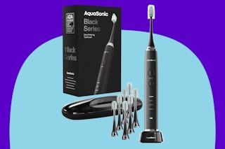  Aquasonic Black Series Ultra Whitening Toothbrush on a blue background.