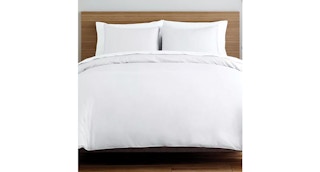 a white duvet set on a bed