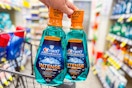 2 bottles of crest mouthwash on a cart