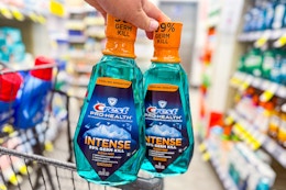 2 bottles of crest mouthwash on a cart