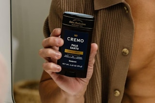 man holding deodorant stick