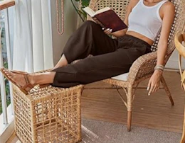 a person sitting in a chair reading a book