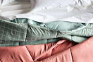the big one comforter on a bed