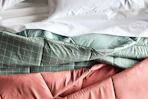 the big one comforter on a bed