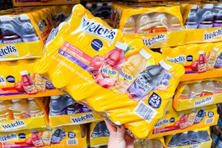 hand holding a pack of welchs juice