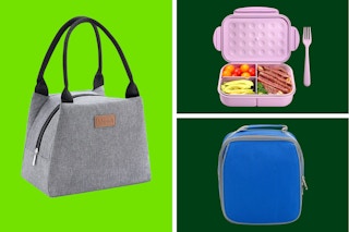 three lunch boxes on a green background