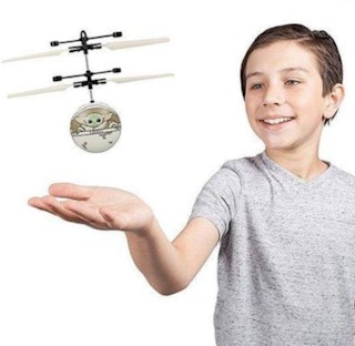 until gone Star Wars The Mandalorian The Child in Pram Motion Sensing UFO Ball Helicopter stock image 2021 1