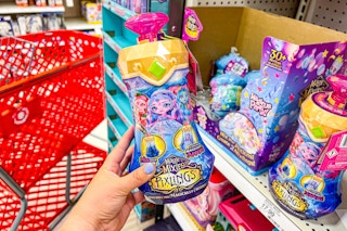 hand holding a magic mixlings pixlings doll at target