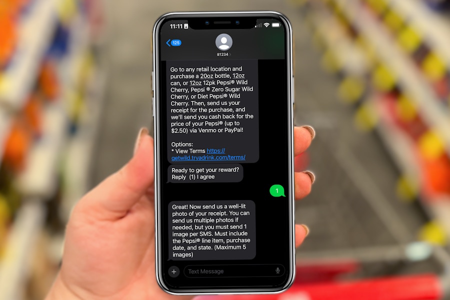 hand-holding-phone-with-text-message-rebate
