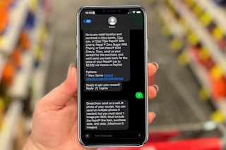 hand-holding-phone-with-text-message-rebate