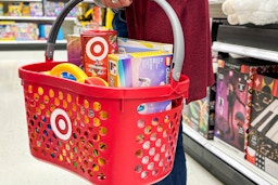 a person holding a basket full of target toys