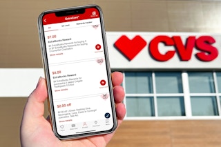 hand holding an iphone showing CVS extrabucks in the cvs app