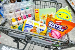 lego, bunch o balloons, and more toys in a cart