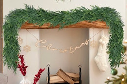 LZNPA Christmas Cedar Garland draped on a fireplace mantle.